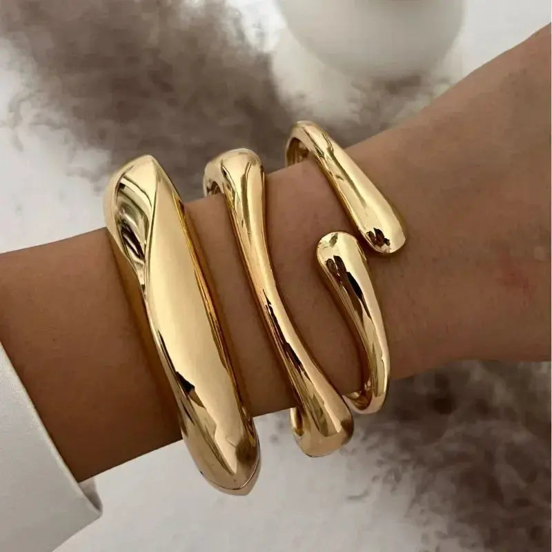 Sterling silver bracelet for women with water drop design in shiny gold finish