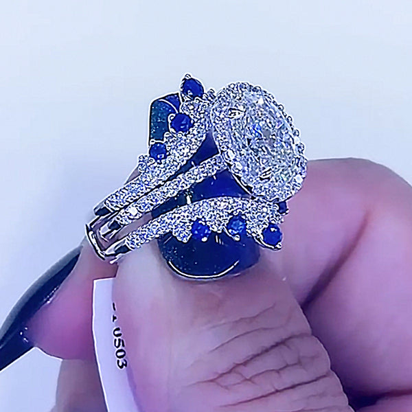 Aurellia Oval Blue Accent Halo Set Yellow Gold