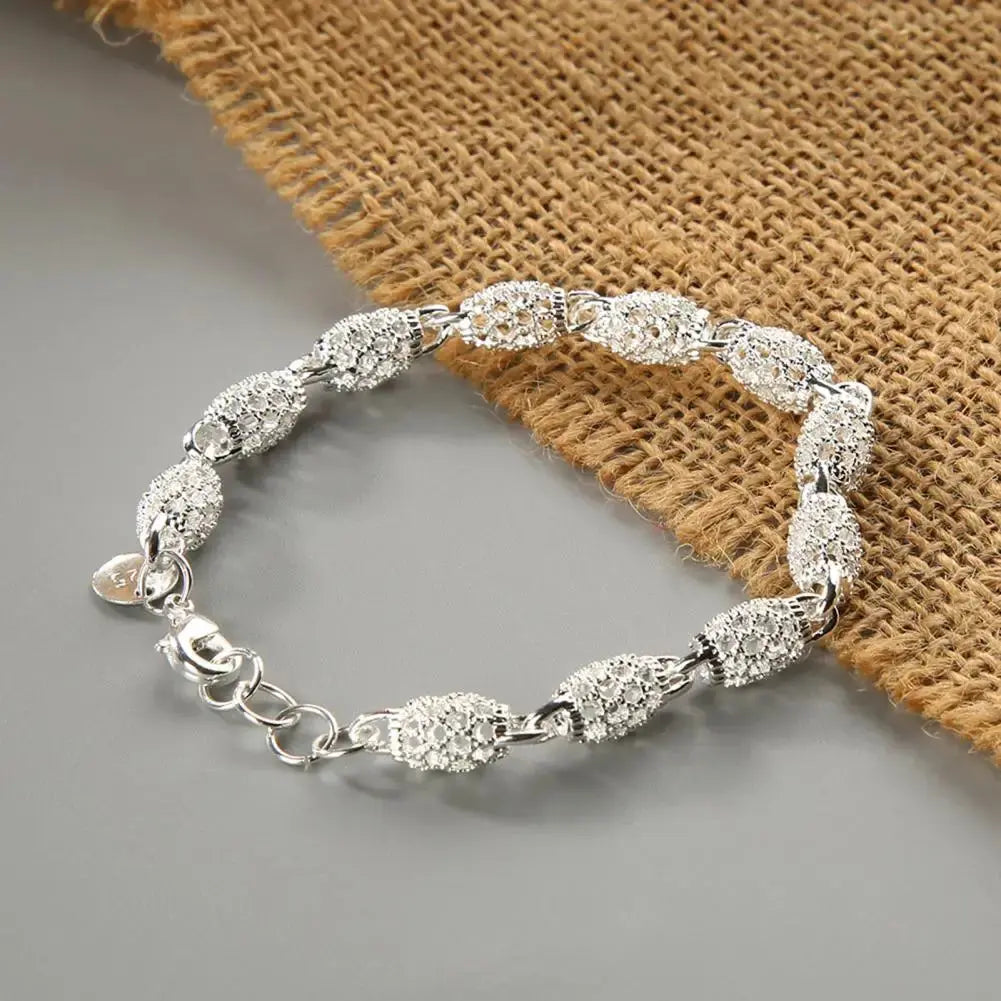 Elegant silver plated hollow ball bracelet for women with delicate link chain and lace-up clasp